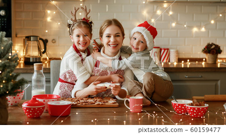 happy family mother and children bake christmas 60159477