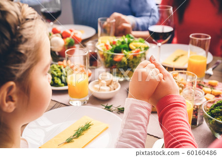 Close up picture. Prayer before meals, catholics pray. 60160486
