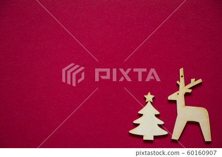 Minimal winter creative table flat lay, wooden figures of Christmas tree and deer 60160907