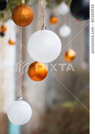 New Year or Christmas background, close-up of white and gold Christmas balls on a blurred background, selective focus 60160938