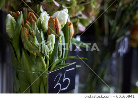 Close-up flower shop window with exotic flowers, selective focus 60160941