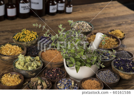 Natural remedy,Herbal medicine and wooden table Natural remedy,Herbal medicine and wooden table 60161586