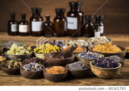 Natural remedy,Herbal medicine and wooden table Natural remedy,Herbal medicine and wooden table 60161763