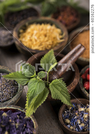 Natural remedy,Herbal medicine and wooden table Natural remedy,Herbal medicine and wooden table 60162276