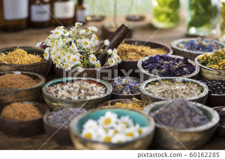 Natural remedy,Herbal medicine and wooden table Natural remedy,Herbal medicine and wooden table 60162285