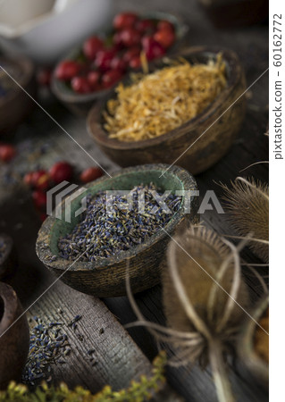 Natural remedy,Herbal medicine and wooden table Natural remedy,Herbal medicine and wooden table 60162772