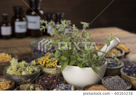 Natural remedy,Herbal medicine and wooden table Natural remedy,Herbal medicine and wooden table 60163238
