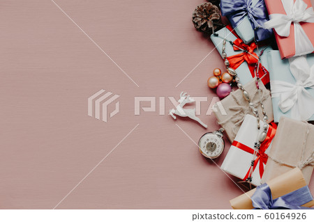Christmas gifts decor new year gifts Christmas tree toys on peach background 60164926