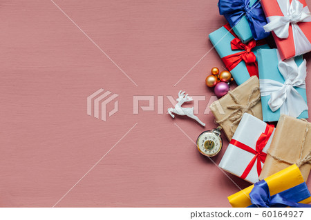 Christmas gifts decor new year gifts Christmas tree toys on peach background Christmas gifts decor new year gifts Christmas tree toys on peach background 60164927