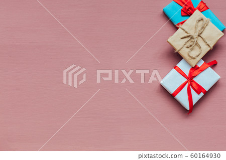 Christmas gifts decor new year gifts Christmas tree toys on peach background Christmas gifts decor new year gifts Christmas tree toys on peach background 60164930