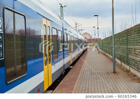 Railway station with passenger train 60165346