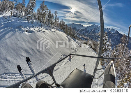 Ski slopes in the mountains, chairlift Ski slopes in the mountains, chairlift 60165348