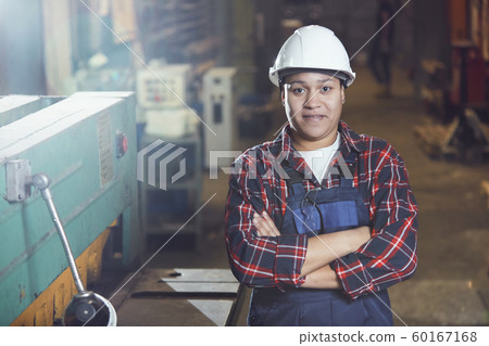 Mixed-Race Female Worker Posing at Plant Mixed-Race Female Worker Posing at Plant 60167168