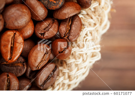 Coffee beans closeup in burlap bag on wooden 60171077