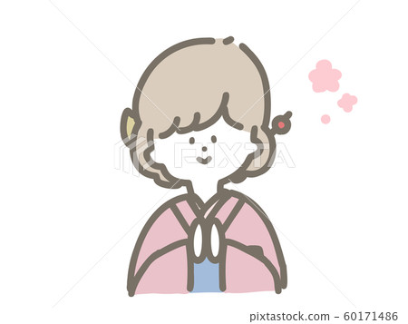  A girl wearing a kimono and posing for a palm 60171486