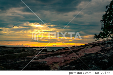 Beautiful stone beach in the morning with golden 60172166