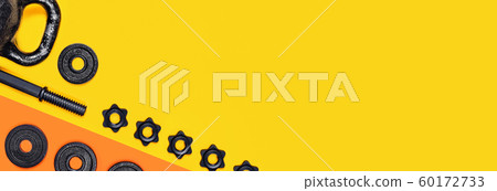 Kettlebells and dumbbells on color background. Kettlebells and dumbbells on color background. 60172733