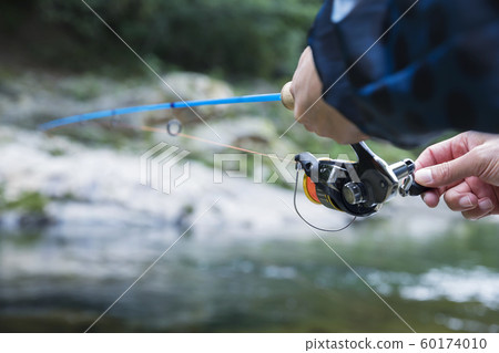 Mountain stream fishing image Male hand 60174010