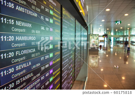 Information monitor with timetable in airport 60175818
