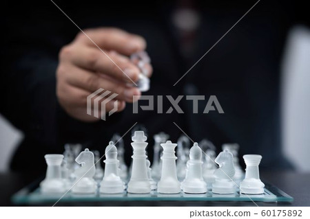 Business image of manager playing chess Business image of manager playing chess 60175892