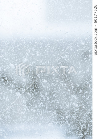 Snow seen through the window 60177526