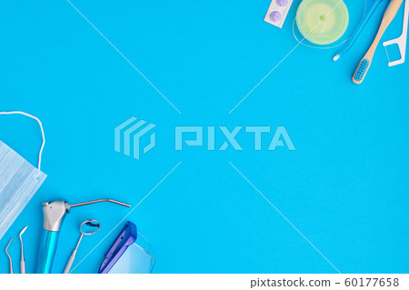 Dentist tools over blue background top view Dentist tools over blue background top view 60177658