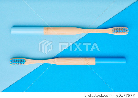Toothbrushes on blue background top view 60177677