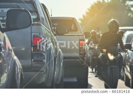 people driving car on road traffic jam with rush hour in the city 60181418