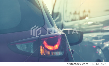 people driving car on road traffic jam with rush hour in the city 60181423