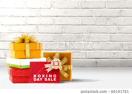 Pile of colorful gift box with ribbon and Boxing Day Sale text 60181781