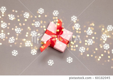 Flat lay of surprise gift box, red ribbon, glitter Flat lay of surprise gift box, red ribbon, glitter 60182045