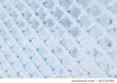 Winter snow texture made of metal mesh covered Winter snow texture made of metal mesh covered 60182046
