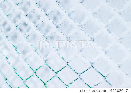 Winter snow texture made of metal mesh covered Winter snow texture made of metal mesh covered 60182047