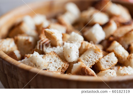 Fried rye crackers on a plate close up. 60182319