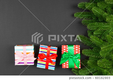 Top view of fir tree branches and gift box on Top view of fir tree branches and gift box on 60182803