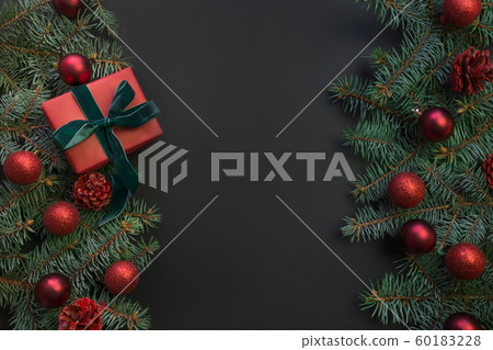 Christmas frame with gift box, evergreen branches. 60183228