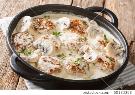 Homemade meatballs cooked with mushrooms served in 60183398