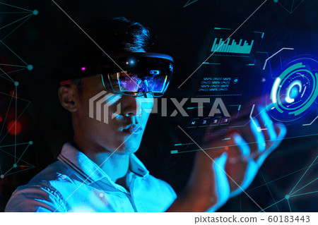 Business man try vr glasses hololens in the dark room. Young asian boy experience ar with glow earth Business man try vr glasses hololens in the dark room. Young asian boy experience ar with glow earth 60183443