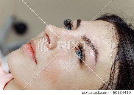 Result of permanent makeup, tattooing of eyebrows 60184419