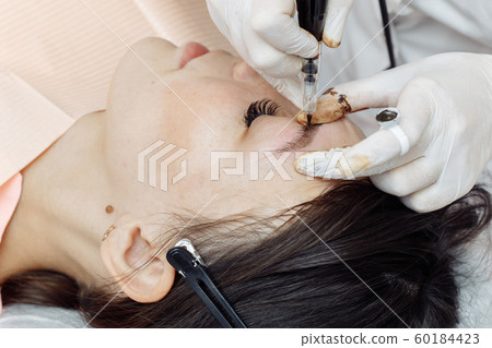 Permanent makeup, tattooing of eyebrows 60184423