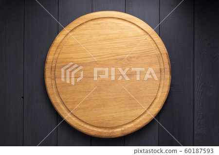 pizza cutting board at rustic wooden plank 60187593