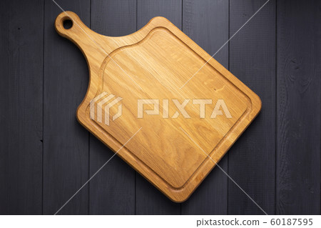 pizza cutting board at rustic wooden plank 60187595