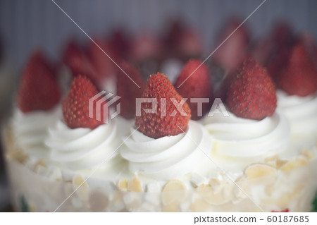 Fresh strawberry topping over whipping cream on Fresh strawberry topping over whipping cream on 60187685