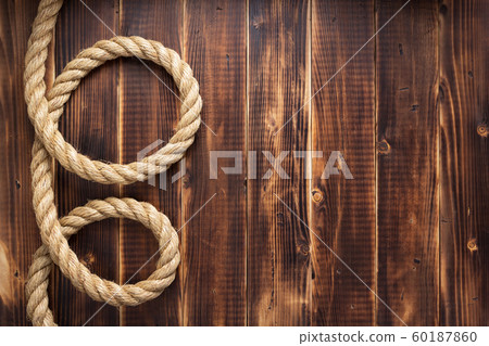 ship rope at wooden background ship rope at wooden background 60187860