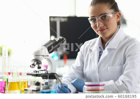 Smiling biomedical researcher in eyewear Smiling biomedical researcher in eyewear 60188195