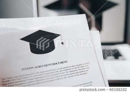 Tuition fee or student loan with calculator. Education price , savings fund college, and expenses concept. Money and papers on table. Calculating budget and planning finance. Tuition fee or student loan with calculator. Education price , savings fund college, and expenses concept. Money and papers on table. Calculating budget and planning finance. 60188282