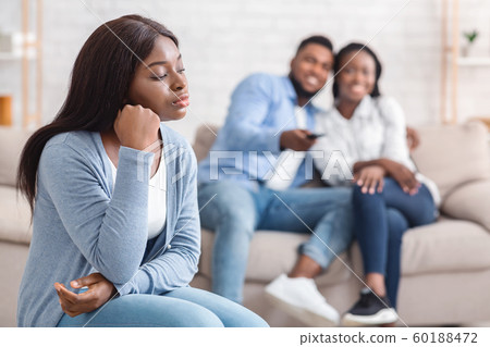 Sad girl envy to her dating friends that having fun together 60188472