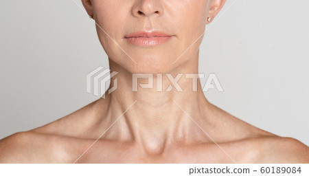 Skin care. Half face portrait of mature woman 60189084