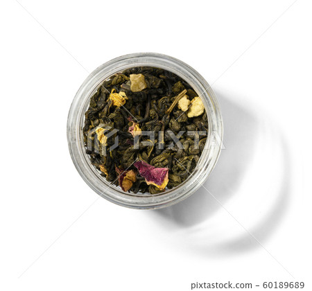 Green tea with aromatic additives. Top view on white background Green tea with aromatic additives. Top view on white background 60189689