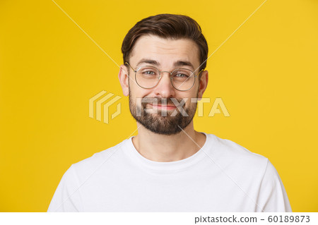 Young casual man portrait isolated on yellow background 60189873